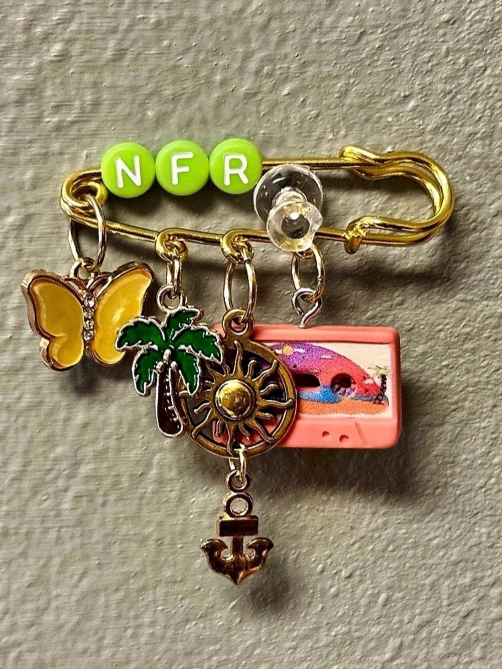 Lana Del Rey "NFR" gold themed brooch, pin, charm